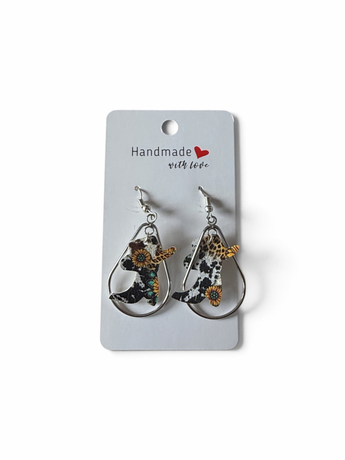 Roselee Glitz western cowgirl boot dangle earrings featuring cow print and sunflower patterns in silver teardrop frames
