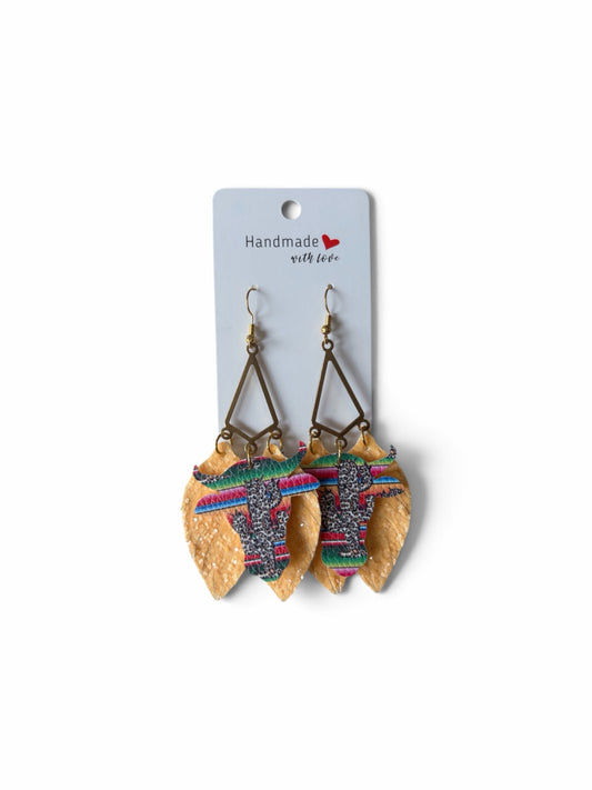 Roselee Glitz western bull head dangle earrings with tan faux leather leaves and multi-colored serape print accents.