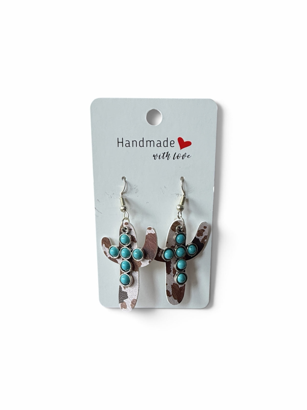 Roselee Glitz handmade cactus dangle earrings with cowhide print and turquoise stone accents on a display card