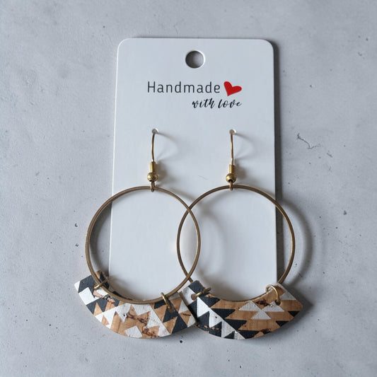 Roselee Glitz handmade geometric hoop earrings with black, white, and tan cork inlays on antique-gold metal hoops.