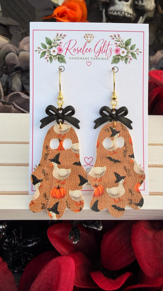 Roselee Glitz ghost-shaped dangle earrings featuring a duck and pumpkin print with black bows on a display card.