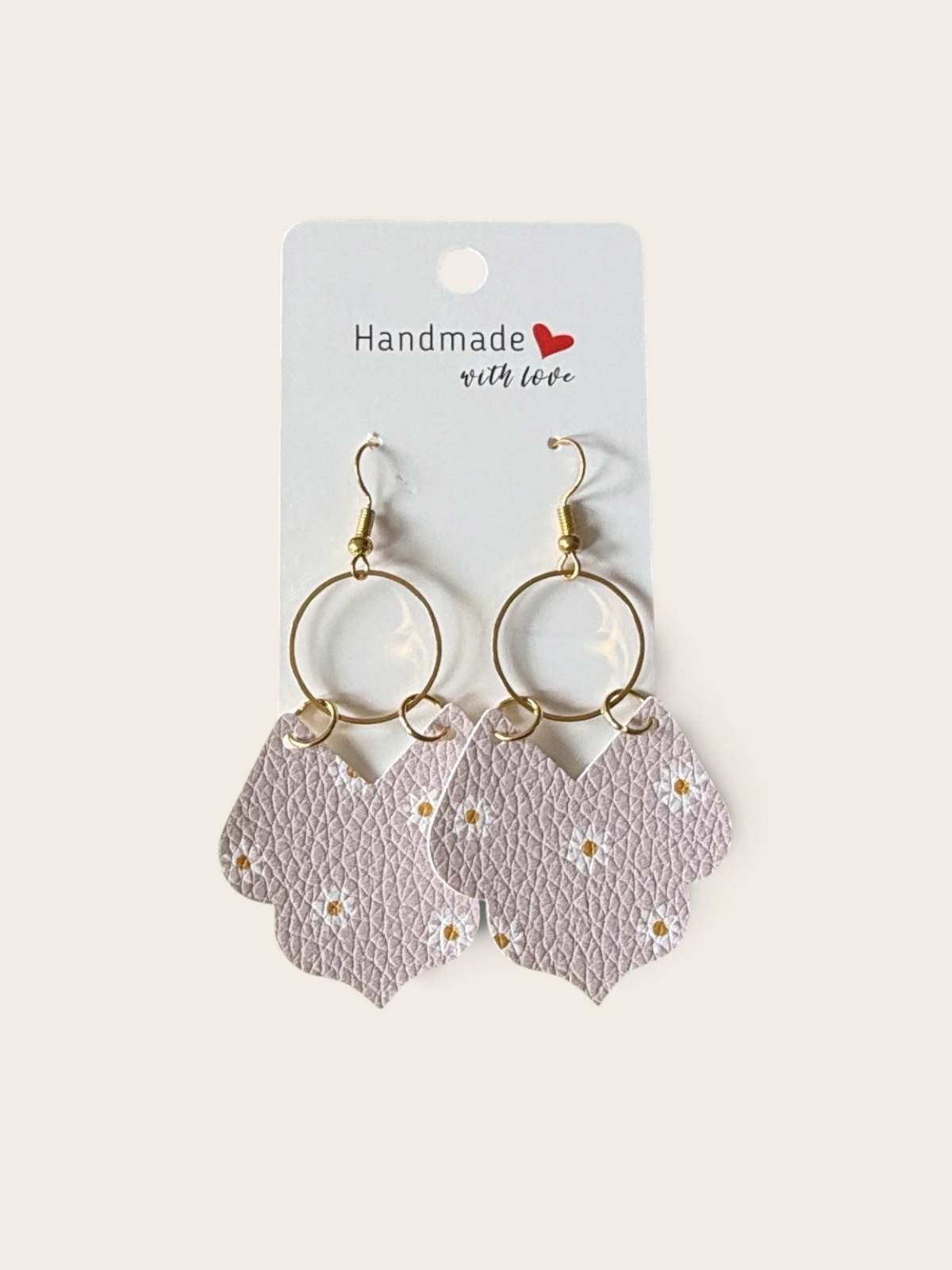 Roselee Glitz lavender faux leather teardrop earrings with white daisy print, gold hoops, and scalloped petal edges.