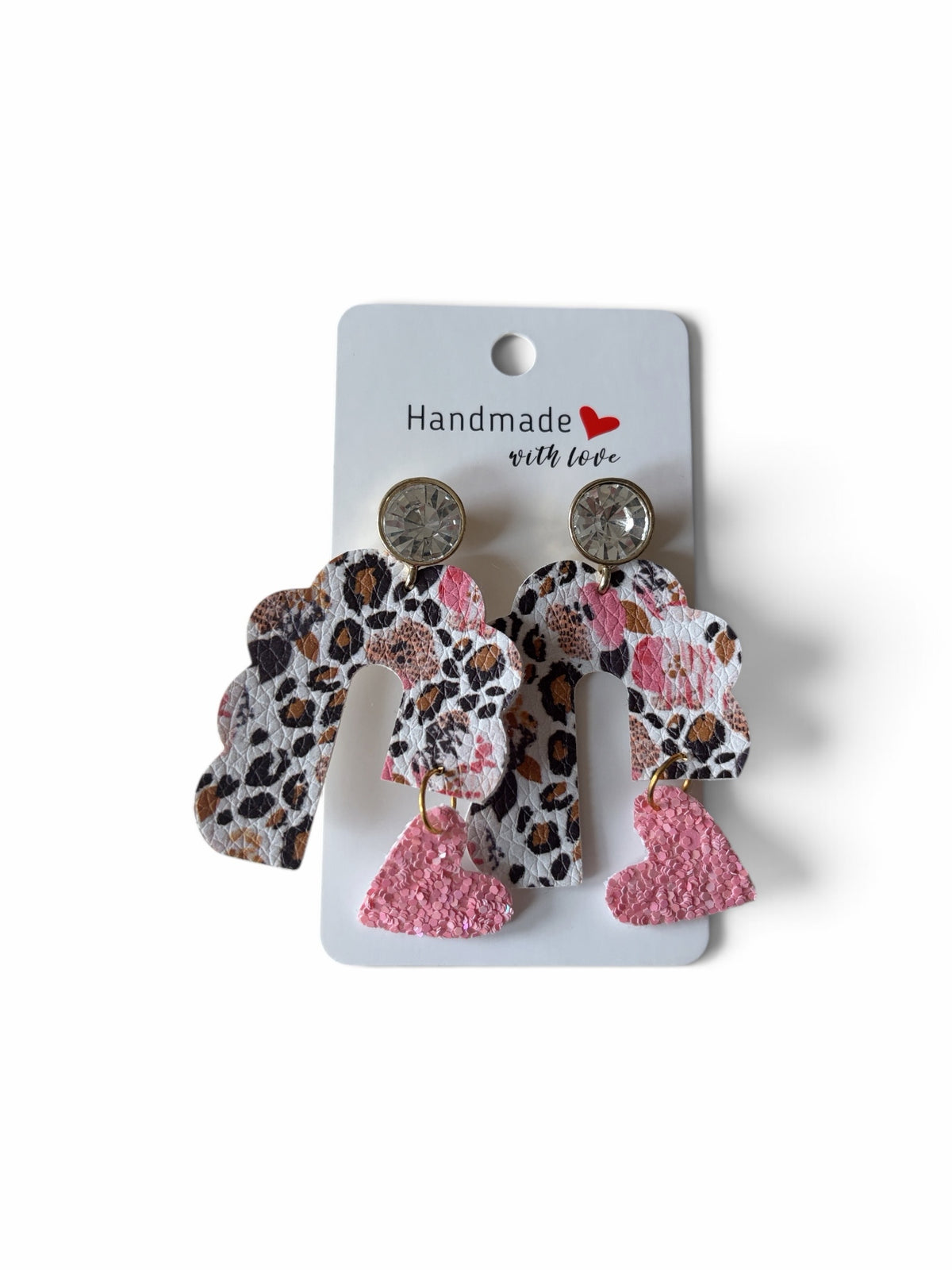 Roselee Glitz handmade faux leather arch earrings with leopard print, crystal studs, and dangling glittery pink hearts.