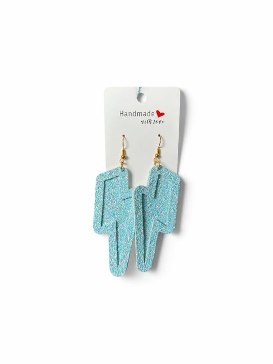 Roselee Glitz light blue glitter lightning bolt dangle earrings with gold-toned hooks on a handmade display card.