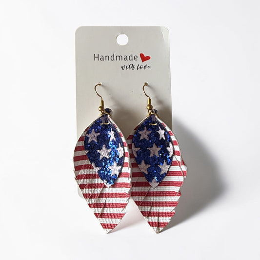 Roselee Glitz patriotic layered leaf drop earrings with glittery blue stars and red and white stripes on faux leather.