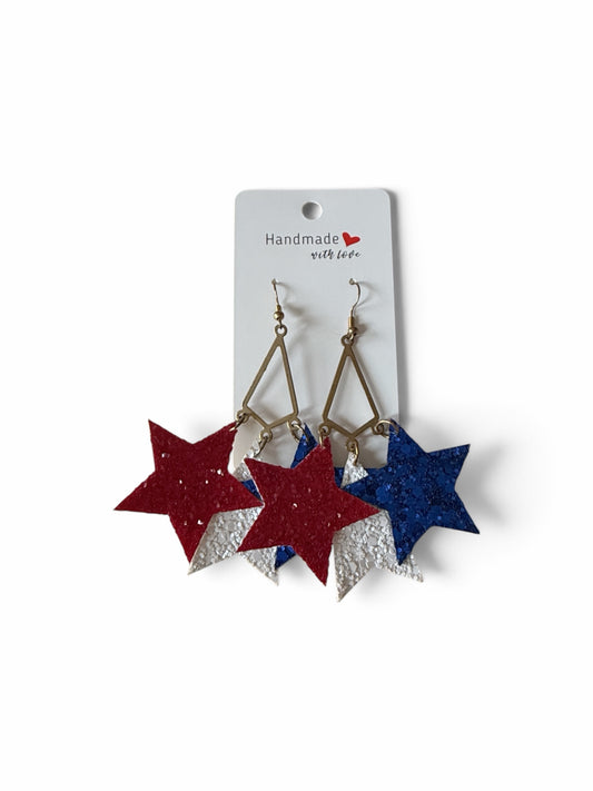 Roselee Glitz handmade patriotic star dangle earrings with red, white, and blue glitter layers on gold-tone frames.