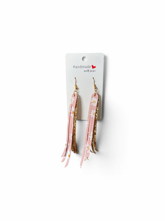Roselee Glitz handmade pink faux leather fringe dangle earrings with white daisy print and gold glitter accents.