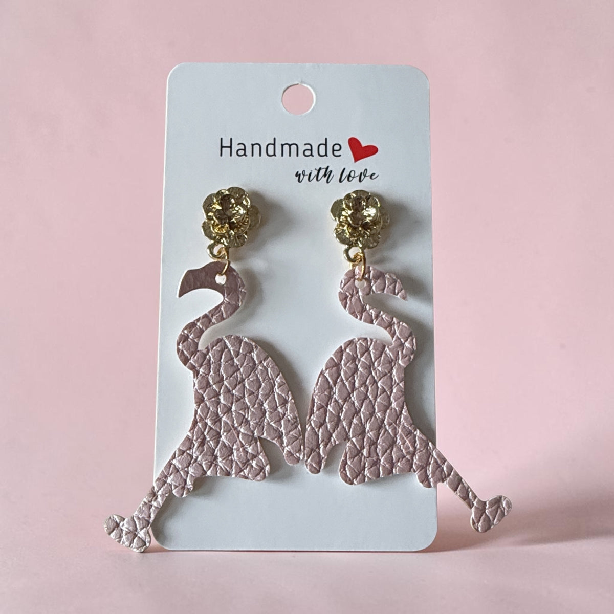 Roselee Glitz dusty rose pink textured faux leather flamingo drop earrings with gold-toned floral stud toppers.