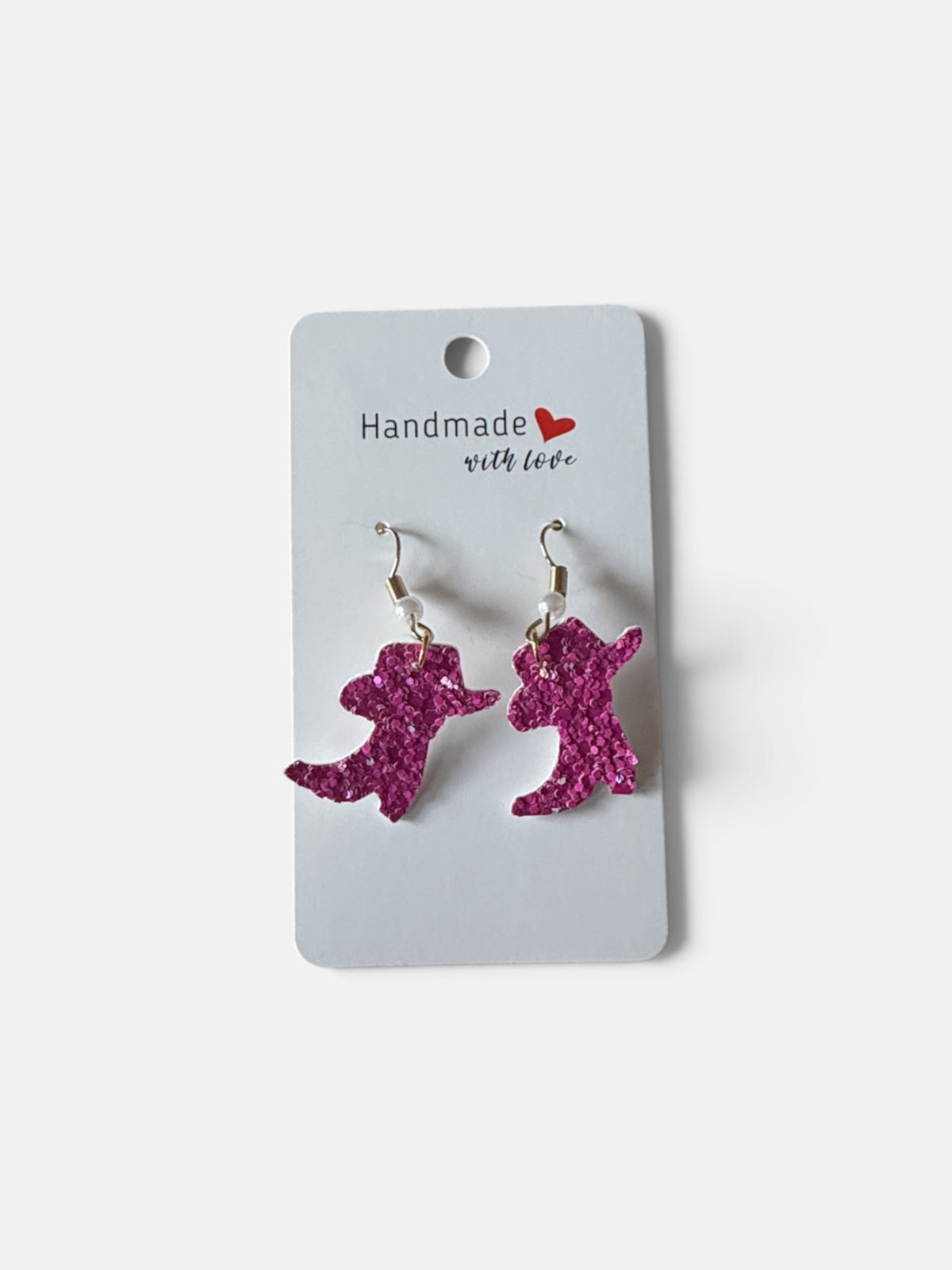 Roselee Glitz pink glitter cowboy boot dangle earrings with hook backings on a handmade display card.