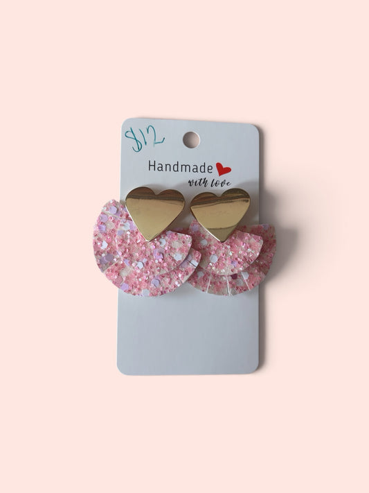 Roselee Glitz handmade statement earrings with gold heart studs and layered light pink glitter fan-shaped drops.