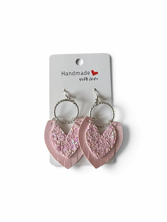 Roselee Glitz layered heart-shaped dangle earrings in soft pink faux leather with glitter accents and silver hoops.