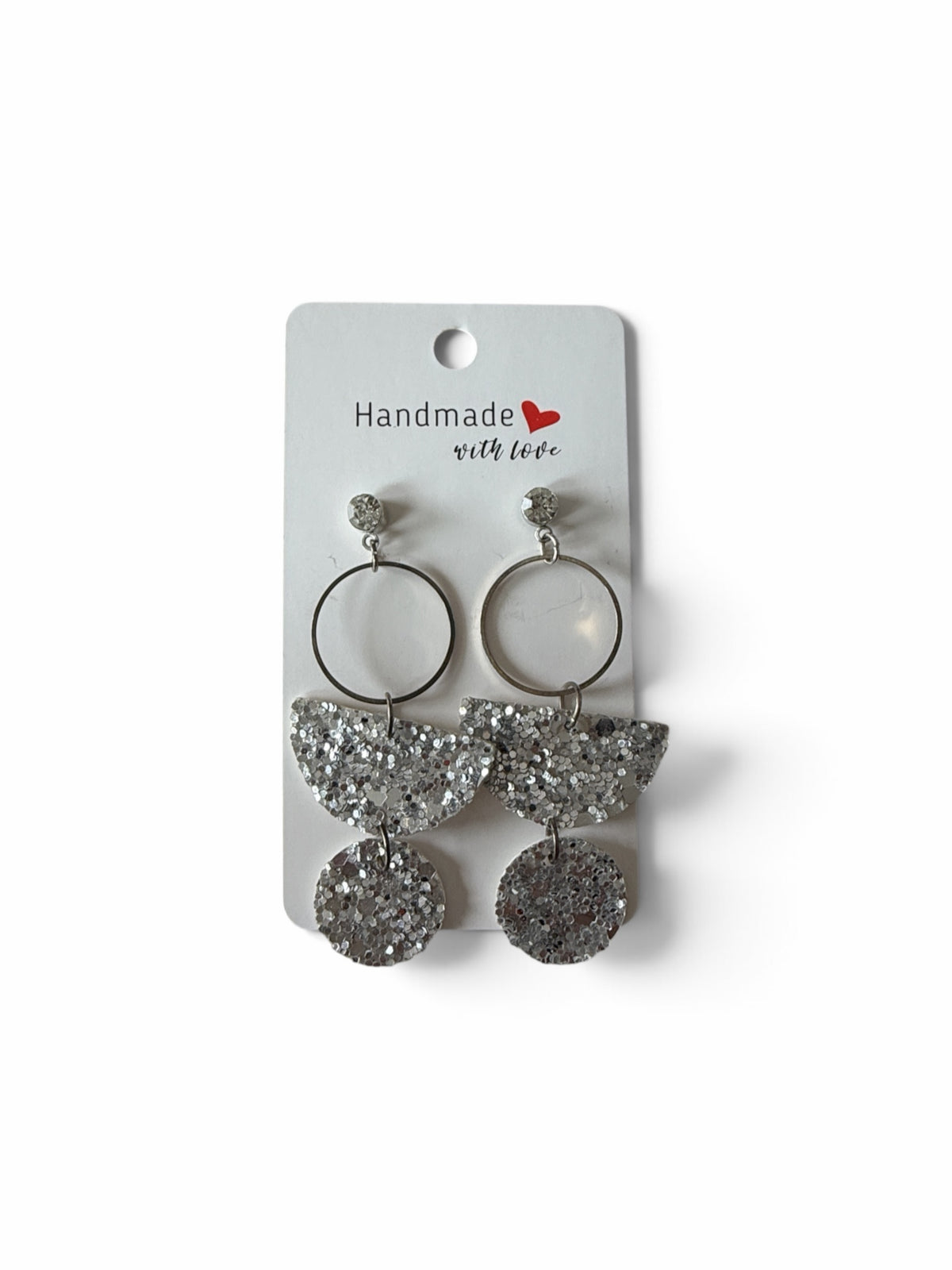 Roselee Glitz handmade silver glitter geometric dangle earrings with circular metal frames on a display card.