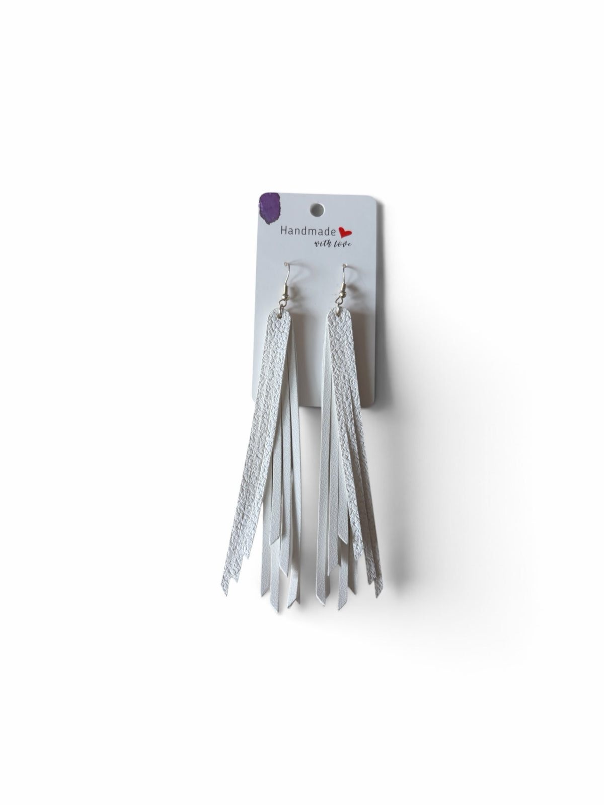 Roselee Glitz handmade white leather fringe dangle earrings with silver-toned hooks on a display card
